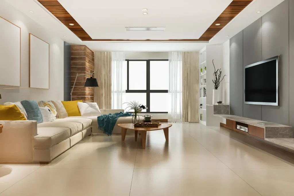 Interior de uma sala de estar moderna e luxuosa, com sofá, televisão e piso de cerâmica. A imagem representa o resultado final de um projeto de construção civil, cujo custo é diretamente influenciado pelo INCC (Índice Nacional de Custo da Construção).
